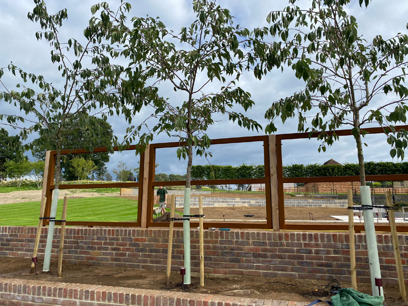 Rusted metal panels with cedar posts