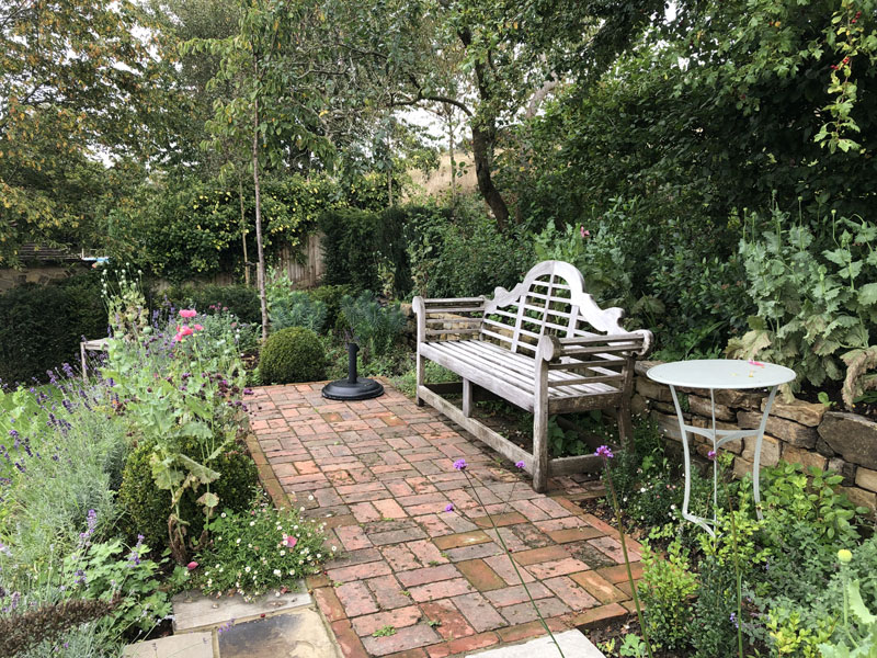 Lutyens bench on brick paving