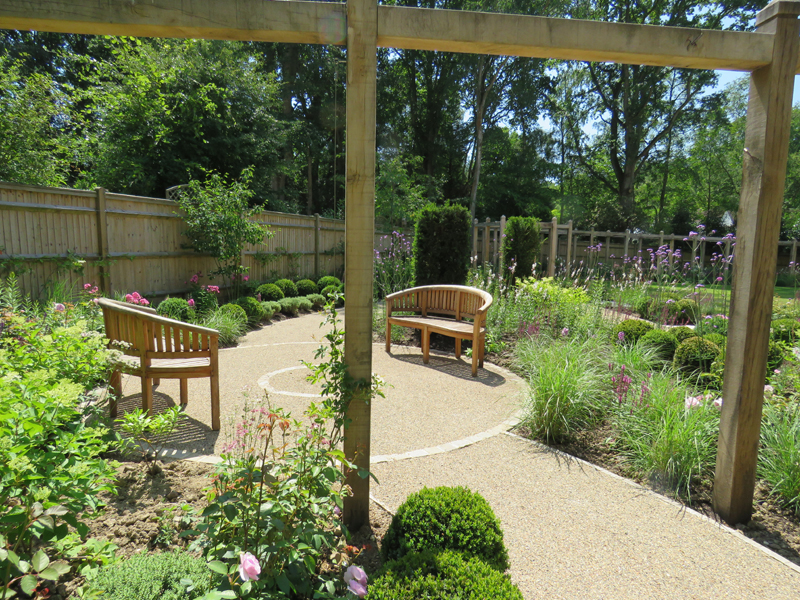 Resin bonding. Oak pergola. Garden path. Garden design Sussex and Surrey. Seating areas.