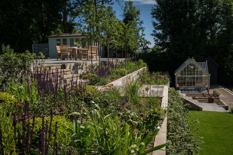 The terraced garden with Alitex glasshouse and levels clearly shown