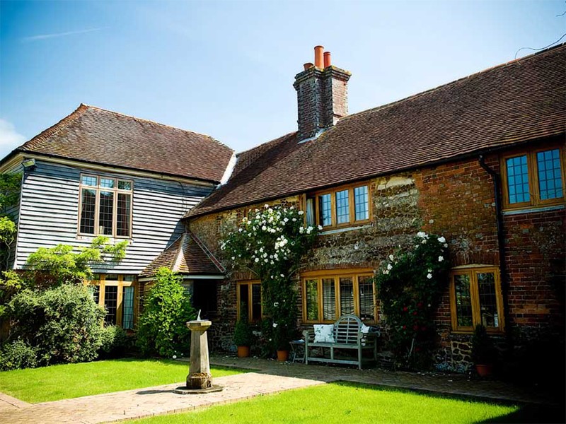 The front of the house with climbing roses