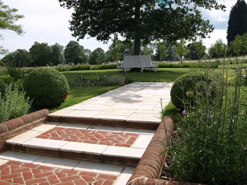 We create brick panels in the wide steps to add interest